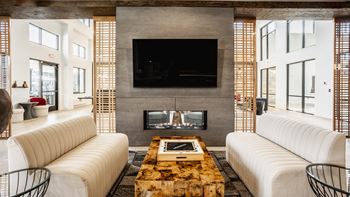 Club room with large screen tvs and a fireplace